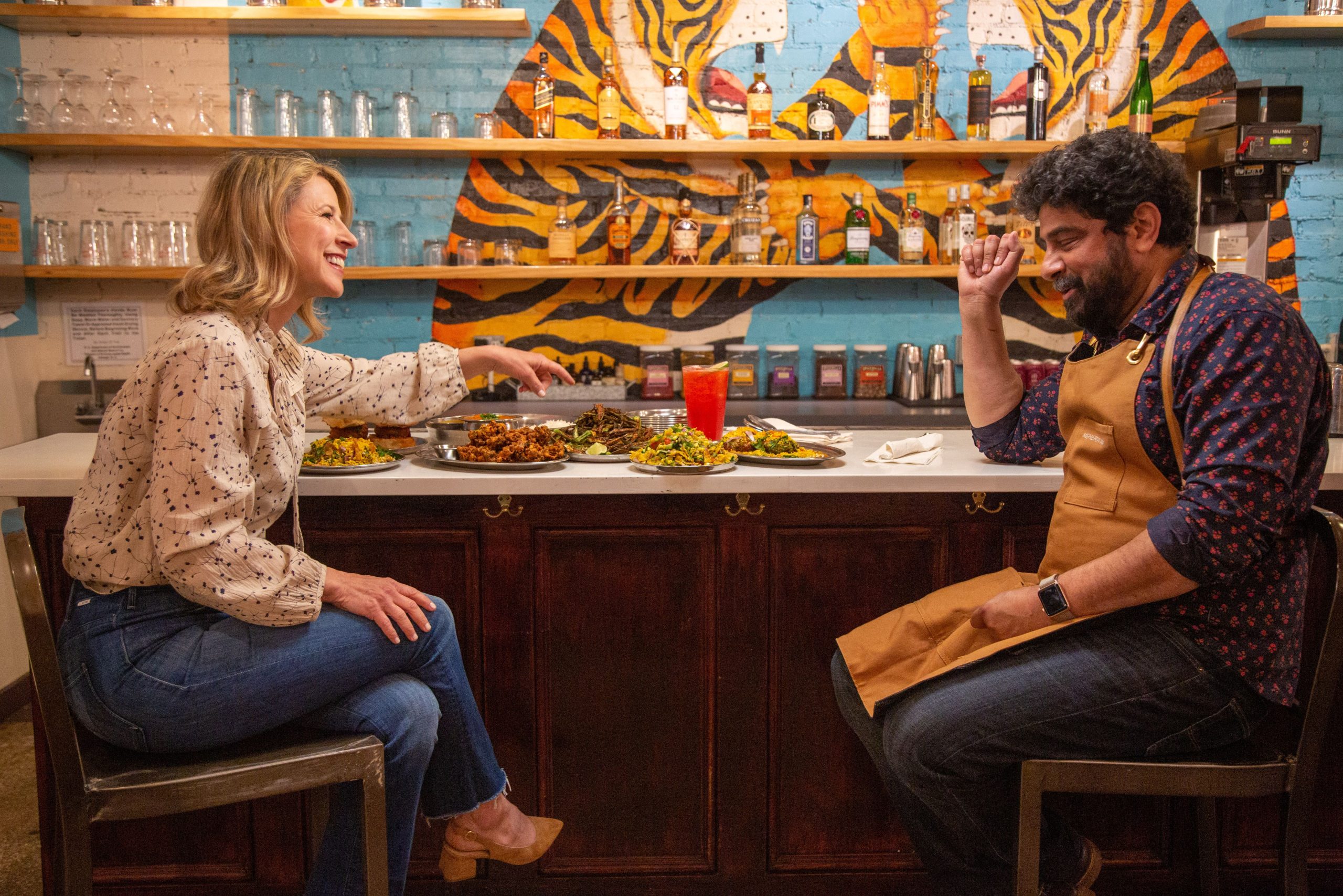 Samantha Brown talking to Chef Meherwan Irani at Chai Pani restaurant in Asheville North Carolina