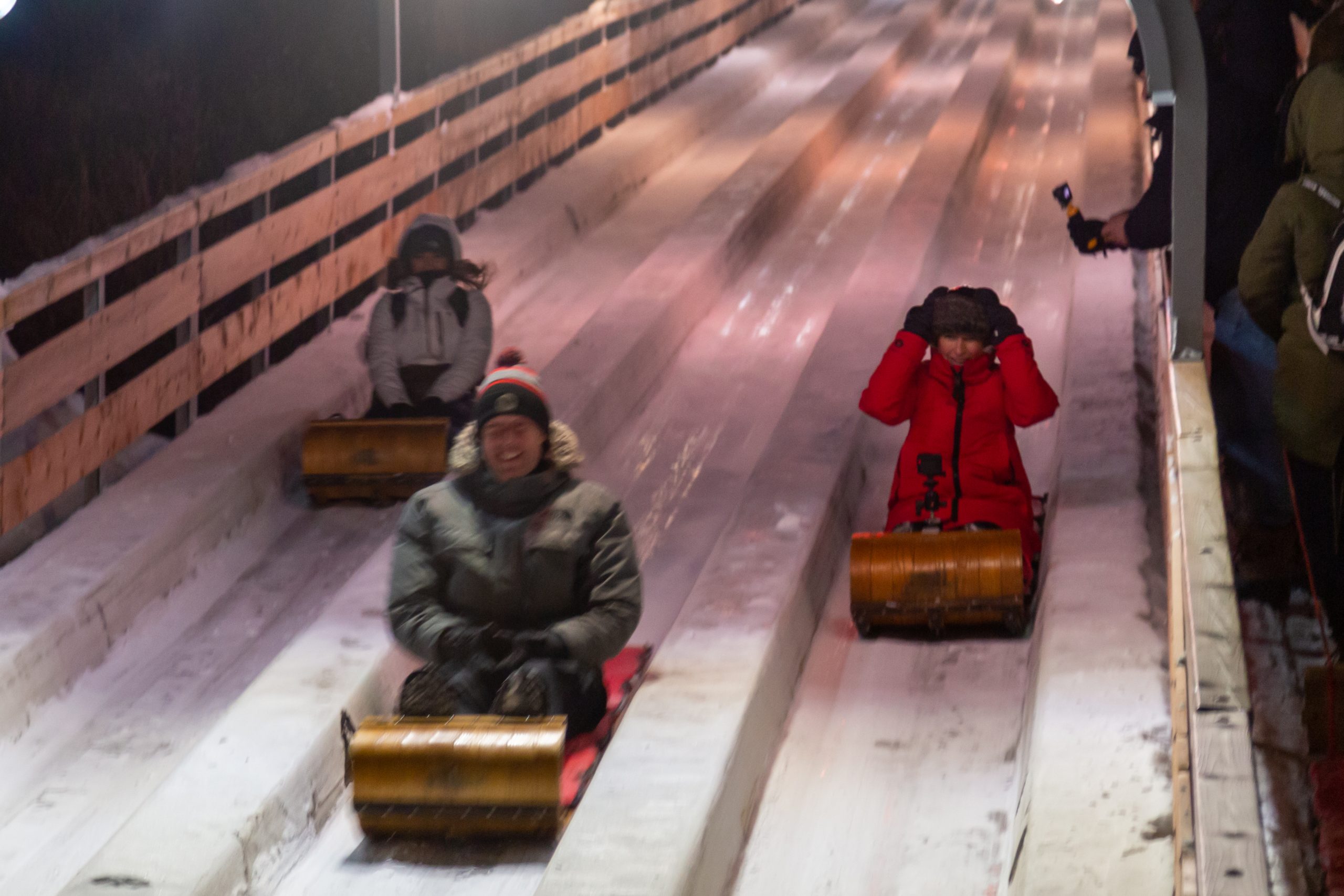 Toboggan down the famous Au 1884 Slide in Quebec City in winter